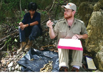 Caleb Kestle, a Ph.D. candidate in anthropology, examines ancient animal bones.