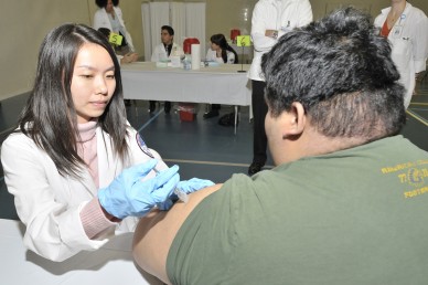 Stephen Hwang, a student in kinesiology, gets a flu shot 