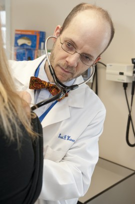 Dr. Saul Weiner examines a patient