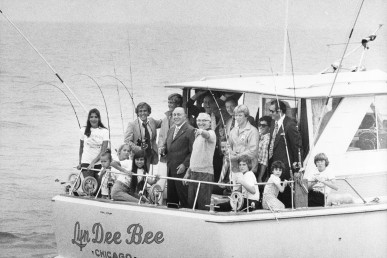 Richard J. Daley and Laszlo Kondor on a boat full of people