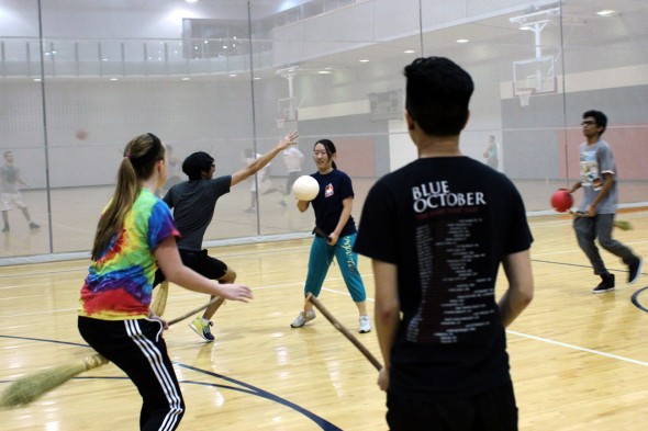 Students playing Quidditch