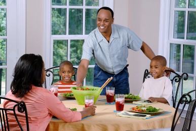 African American family having dinner