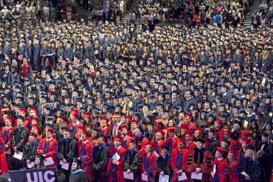 Crowd of graduates standing during ceremony