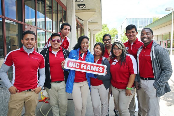 The Orientation Team holding a UIC Flames sign