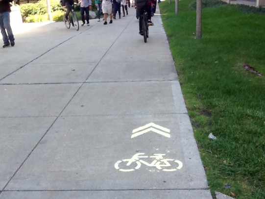 bike lane marker on the sidewalk