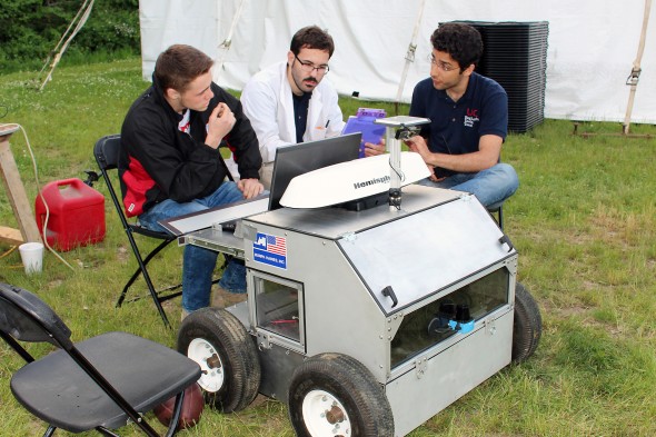 Members of UIC's Chicago Engineering Design Team discuss their robot