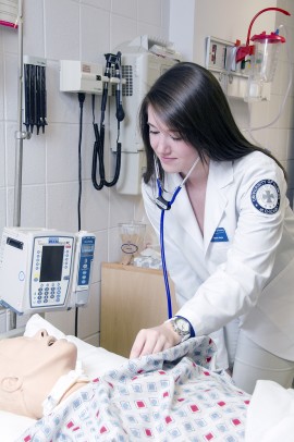 Allyson Joyce practices nursing skills on a dummy patient