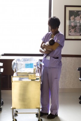 nurse holding baby
