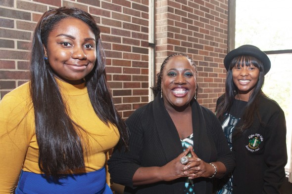 Sheryl Underwood with students Daera Jones, left, and Mikita Lee, right
