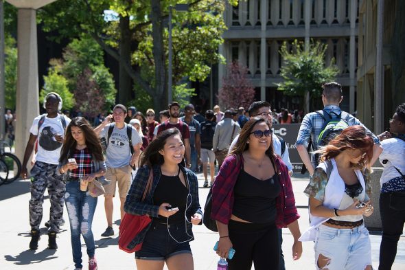 crowd of students walking on east campus