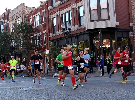 Chicago Marathon participants running down Taylor Street