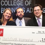 MBA students with first-place check for business plan competition.