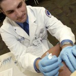 Pharmacy student administers a flu shot