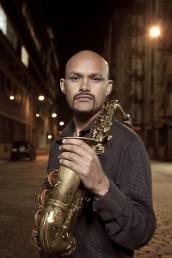 Miguel Zenon holds a saxophone
