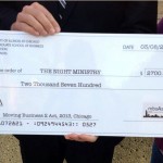 Extra large check for $2,700 for the Night Ministry