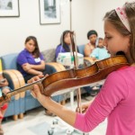 Clarissa Bevilacqua plays violin at the Children's Hospital