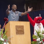 Men’s basketball head coach Howard Moore and Sparky D. Dragon at convocation.