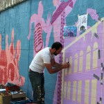 Nick Goettling working on the Morgan Street Mural