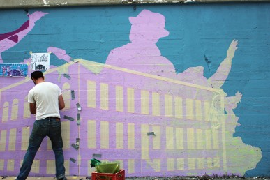 Nick Goettling working on Morgan Streen Mural