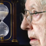 Elderly woman and an hourglass