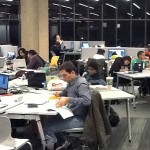 students in the IDEA Commons at night