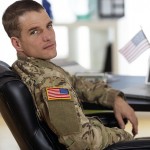 American soldier sitting at a laptop
