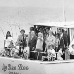 Richard J. Daley and Laszlo Kondor on a boat full of people