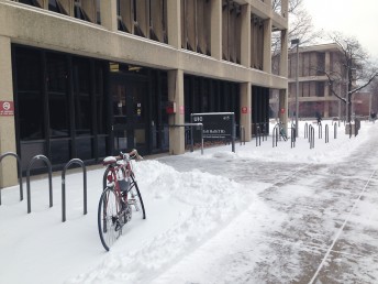 bicycle locked up in the snow