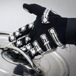Hand wearing haptics glove holding the lid of a pot