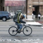 Man riding a bike in winter