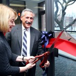 Linda Deanna and Lon Kaufman cut the ribbon to open the center