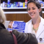 pharmacist helps a customer