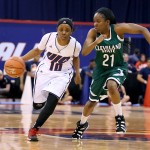 Terri Bender races a Cleveland State player down the court