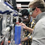 Lukasz Adamczyk and Nikhil Chintalpudi create acetylene gas in the new physical chemistry lab