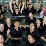 Nursing seniors jump in pool to celebrate graduation