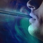 man with e-cigarette in mouth