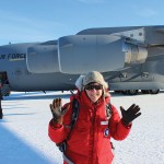 Hilary Dugan next to an Air Force plane in Antarctica