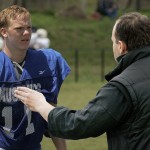 football coach talking to player