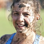 girl covered in mud