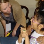 UIC occupational therapy student Carson Mumma works with a student at Centro Ann Sullivan del Peru in Lima, a UIC exchange program in the College of Applied Health Sciences.