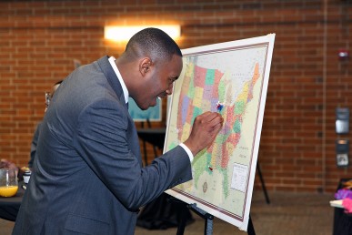 man places a pin on a map at the school into which he placed on match day