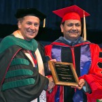 College of Medicine dean Dimitri Azar presents Subhash Pandey with the Faculty of the Year Award
