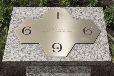 bronze plaque designed by campus architect Walter Netsch commemorating the 1st commencement