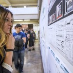 woman looks at architecture plans