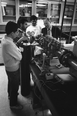 John Kiefer working with students in a lab