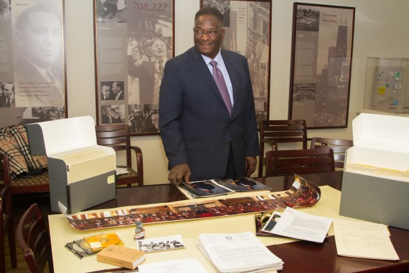 Former Illinois Senate President Emil Jones, Jr. with some of the papers he is donating to UIC.