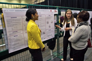 two students presenting their poster