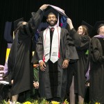 graduate recieves his hood