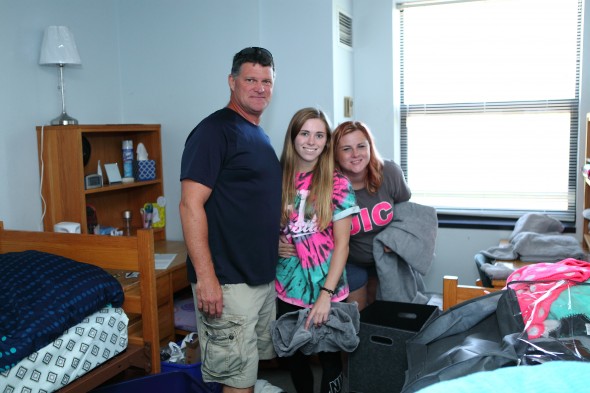 Freshman Rachel MacDowell settled into her residence hall with help from her parents. Photo: Jenny Fontaine