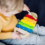 child with xylophone toy
